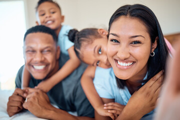 Obraz premium Family selfie, children and bonding in bedroom of house, home or hotel in trust, love or security pov. Portrait, smile or happy mother, father and kids in photography for social media profile picture