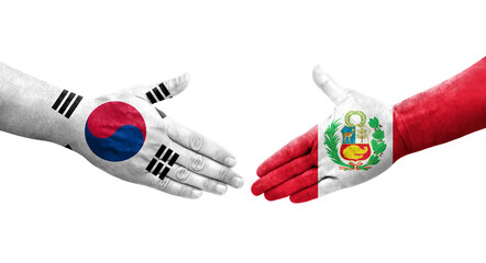 Handshake between South Korea and Peru flags painted on hands, isolated transparent image.