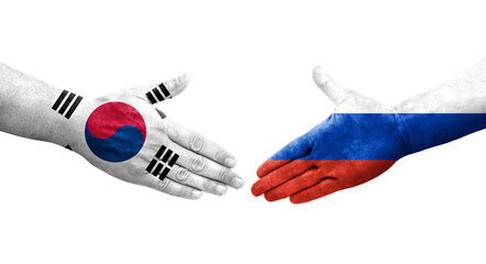 Handshake between South Korea and Russia flags painted on hands, isolated transparent image.