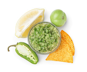 Bowl of green salsa sauce and ingredients on white background