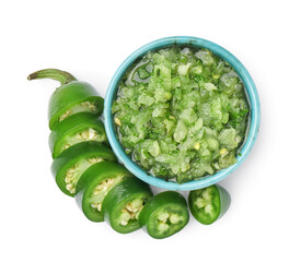 Bowl of tasty green salsa sauce isolated on white background