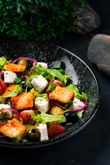 Fresh greek salad feta cheese, croutons, lettuce, olives, tomatoes, onion and olive oil.