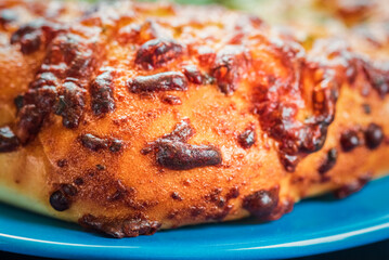 Delicious homemade bread, pastries on a wooden background.
