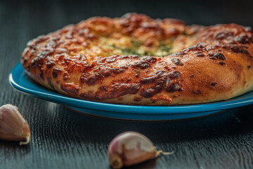 Delicious homemade bread, pastries on a wooden background.