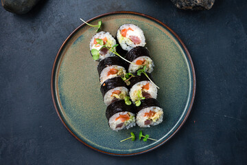 Sushi rolls with tuna, salmon, Philadelphia cheese, avocado and microgreens.