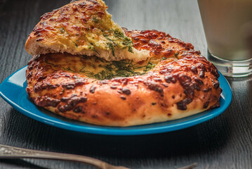 Delicious homemade bread, pastries on a wooden background.