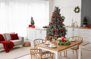 Interior of kitchen with Christmas trees and dining table