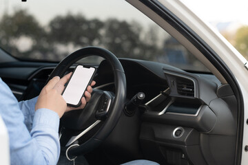 Driver showing a smartphone with a white screen