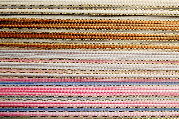 Woven texture multicolored background. Seamless fabric background