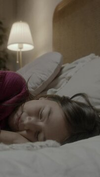 Young asian girl sleeping on a bed