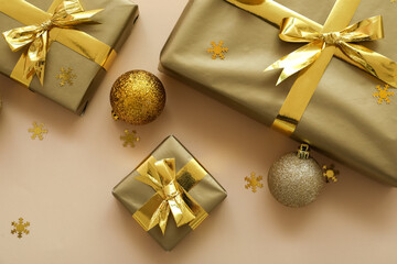 Composition with beautiful Christmas gifts and balls on color background, closeup