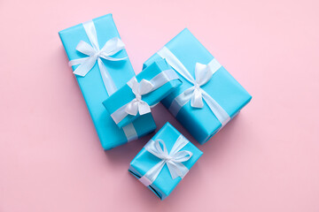 Beautiful Christmas gifts on pink background