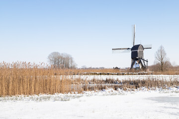 Windmill built in 1683 -  Oudendijkse molen, in the Dutch winter landscape.
