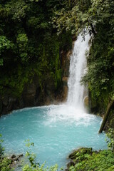waterfall with crystal clear blue water in costa rica