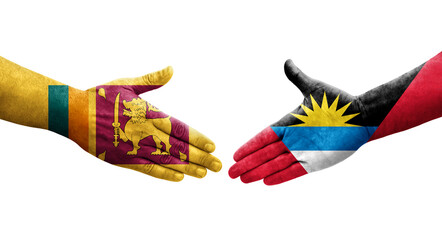 Handshake between Sri Lanka and Antigua Barbuda flags painted on hands, isolated transparent image.