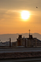 Obraz premium Sunrise over a church in Rome, Italy