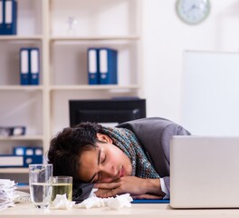 Man with flu working in the office