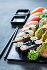 Delicious and healthy sushi set made of seafood and vegetables.