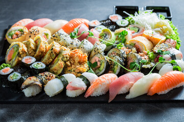 Tasty and fresh sushi set served with soy sauce.