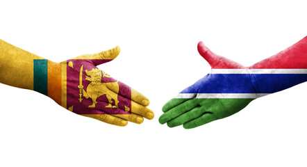 Handshake between Sri Lanka and Gambia flags painted on hands, isolated transparent image.