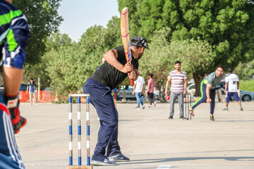 local people playing cricket sport