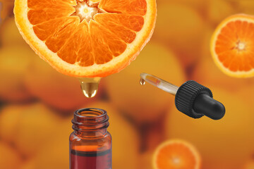 Vitamin C cosmetic product concept. Orange essential oil with pipette.