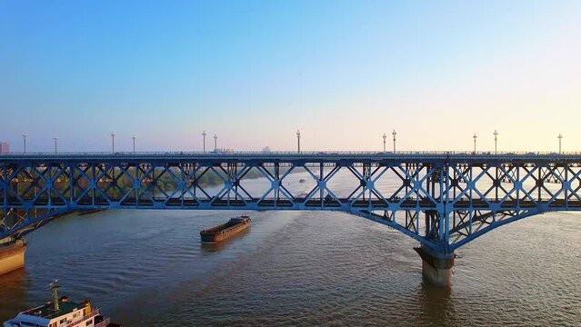 Early morning aerial view of trains driving on Nanjing Yangtze River Bridge in Jiangsu, China