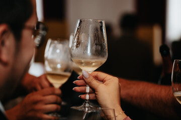 Cheers, we celebrate friendship with a glass of wine white, rose and champagne with friends and loved ones in a memorable evening.