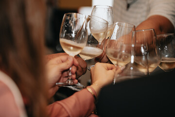Cheers, we celebrate friendship with a glass of wine white, rose and champagne with friends and loved ones in a memorable evening.