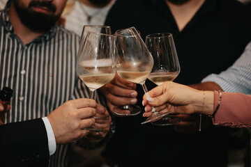 Cheers, we celebrate friendship with a glass of wine white, rose and champagne with friends and loved ones in a memorable evening.