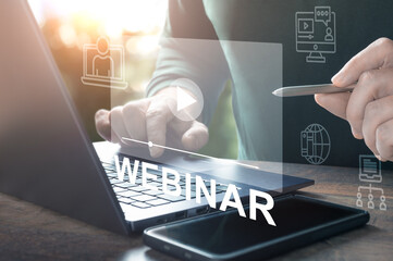Webinar online. Hand use E-business Browsing Connection on laptop. online seminar. hand typing on...