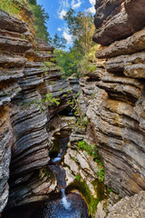 Rosomački Lonci (canyon of river Rosomača) in Stara Planina mountains are called Rosomački pots, because of the unusual shape, edges layered with multiple extensions with whirlpools