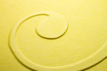 Extreme macro of embossed yellow paper