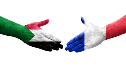 Handshake between Sudan and France flags painted on hands, isolated transparent image.