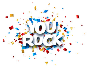 You rock sign on colorful cut ribbon confetti background.