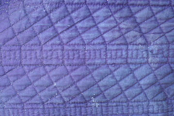 fabric texture from a piece of violet dirty old matter with a pattern on clothes