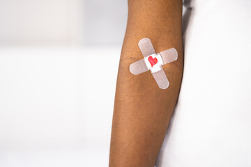 Blood Donation Concept. African American Donor With Band Aid