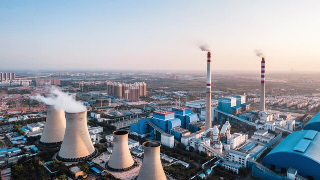 Aerial timelapse photography of a coal-fired thermal power plant at dusk in Hohhot, Inner Mongolia, China