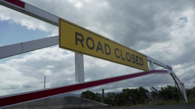 Road Closed signpost on cloudy day 