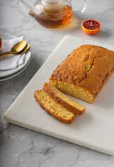 Orange pound cake with fresh bloody orange. Vertical