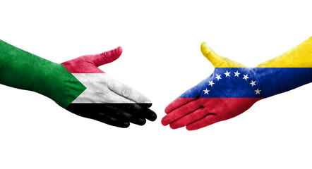 Handshake between Sudan and Venezuela flags painted on hands, isolated transparent image.