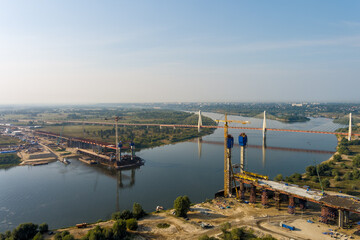 Fototapeta na wymiar Murom, Russia. Murom bridge. Construction of a bridge across the Oka River. Construction site of the highway M12, Moscow - Kazan. Aerial view