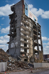 Old building being demolished to make room for new architecture. Construction Demolition Site. Destroyed building, can be used as demolition, earthquake, bomb, terrorist attack or natural disaster - obrazy, fototapety, plakaty
