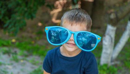 Children enjoy nature in glasses. Selective focus.