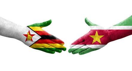 Handshake between Suriname and Zimbabwe flags painted on hands, isolated transparent image.