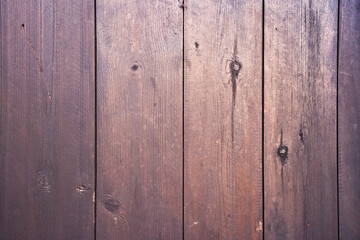 Natural wood background texture with wood grain pattern, knots and cracks in narrow boards. 