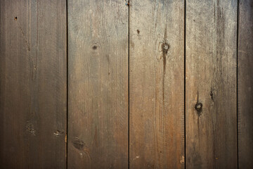 Natural wood background texture with wood grain pattern, knots and cracks in narrow boards. 