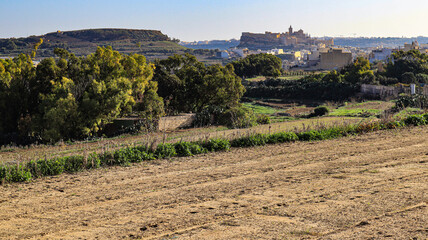 Fototapeta na wymiar Looking towards the Citadel , Victoria from Santa Lucija on the Mediterranean island of Gozo in the Maltese archipelago. 