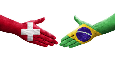Handshake between Switzerland and Brazil flags painted on hands, isolated transparent image.