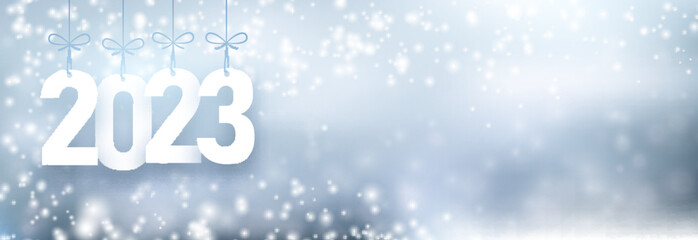 Banner with hanging 2023 sign on silver grey snowing background.